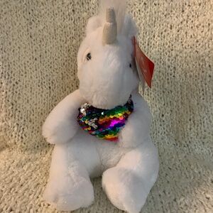 Aurora plush white unicorn with shiny multicoloured heart.